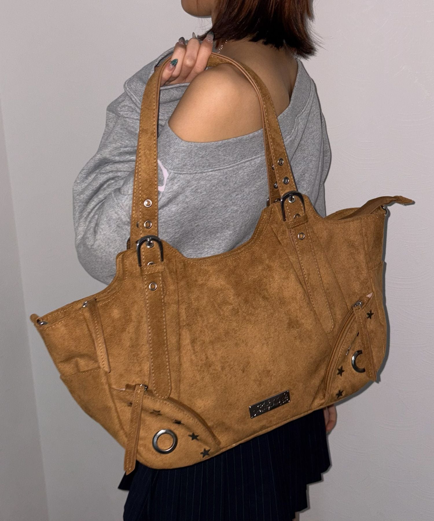 sqnz star eylet bag / フェイクレザー フェイクスウェード バック アジャスター ハンドバック ハトメ
