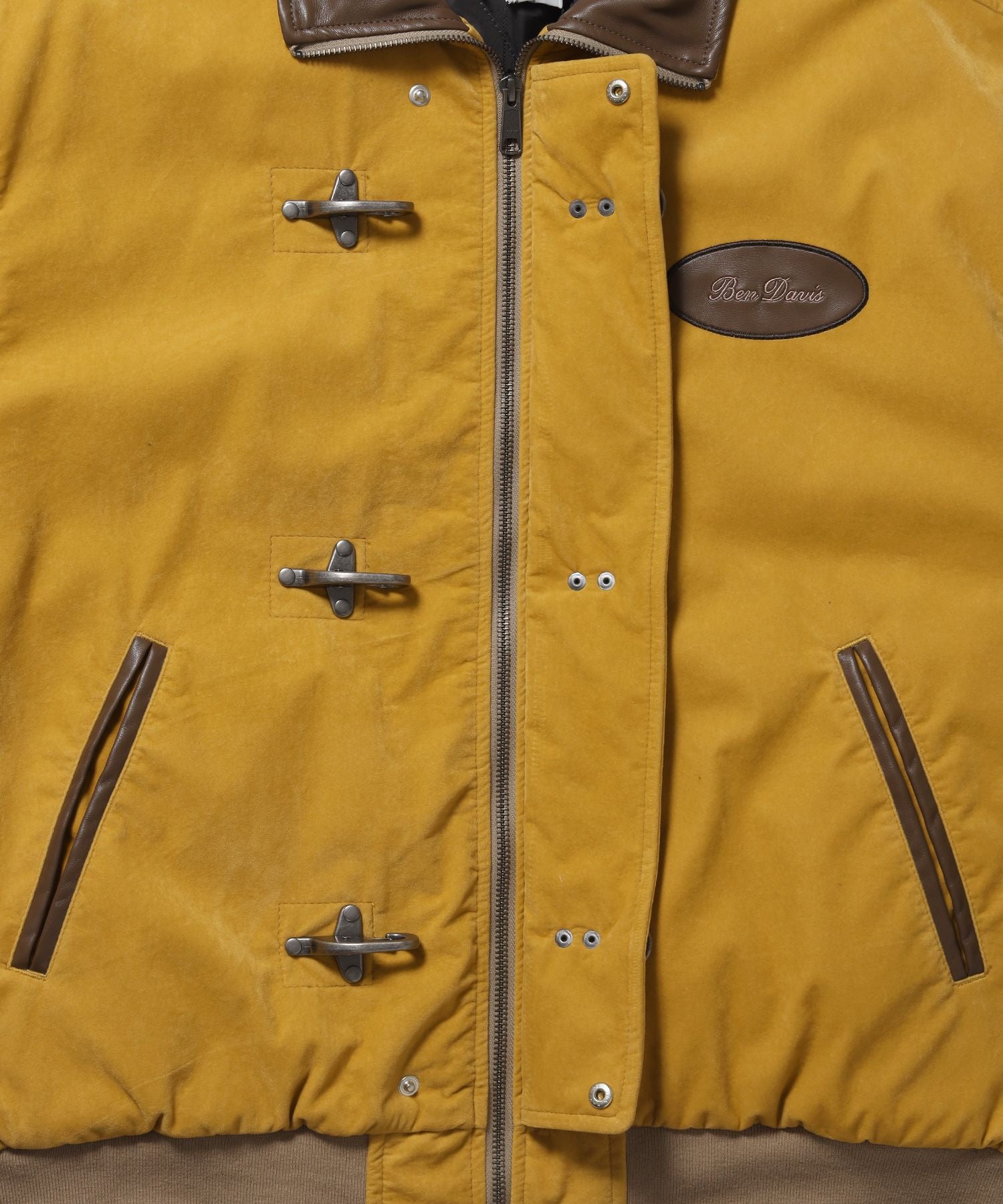 FAUX SUEDE RESCUE JACKET / レスキュージャケット フェイクスエード 中綿キルティング ハイネック ワッペン アウター ユニセックス マスタード