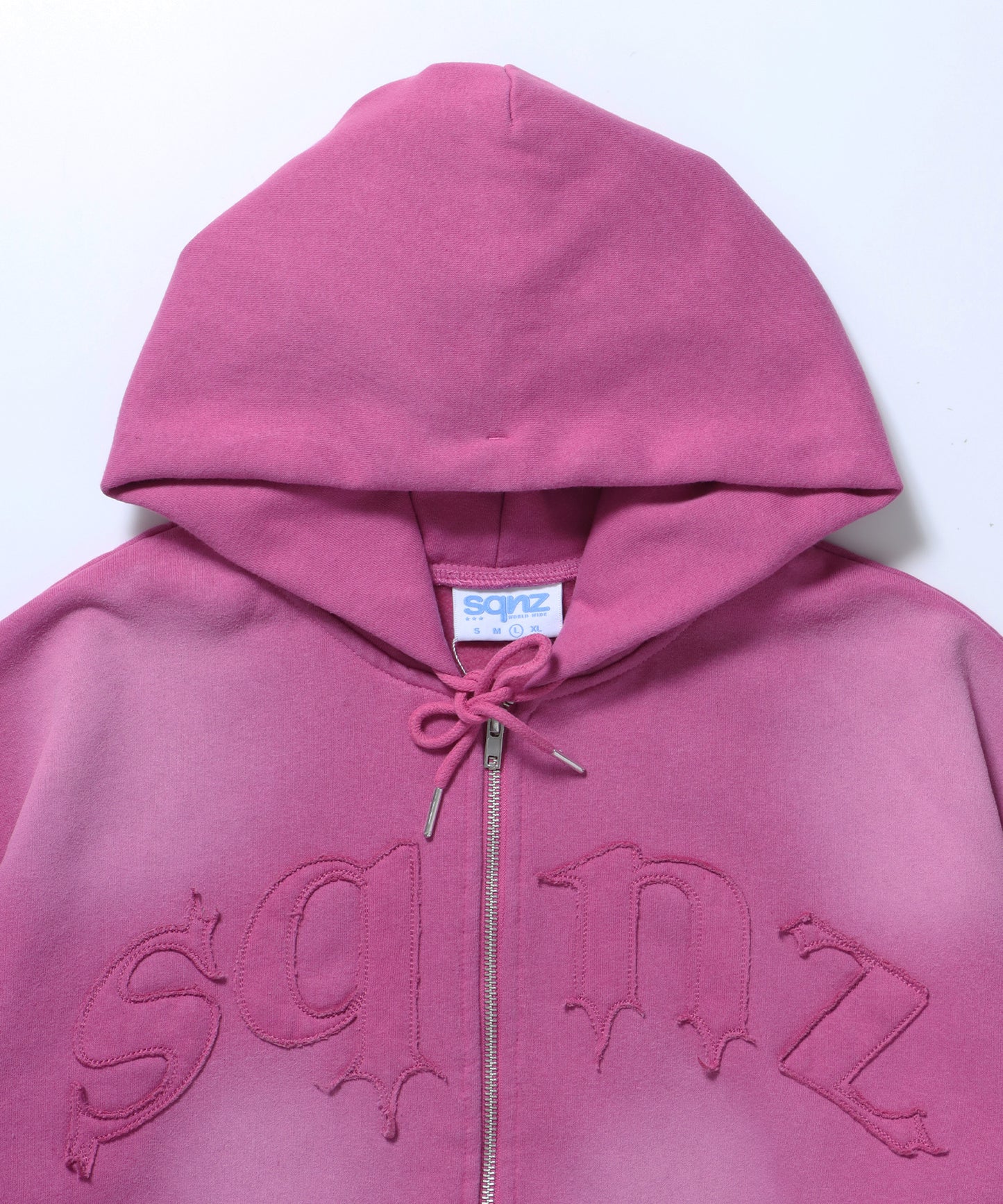 sqnz washed wappen zip p/k / フェード ジップパーカー スタッズ フルジップ オーバーサイズ ヴィンテージライク センターロゴ 裏起毛 ピンク