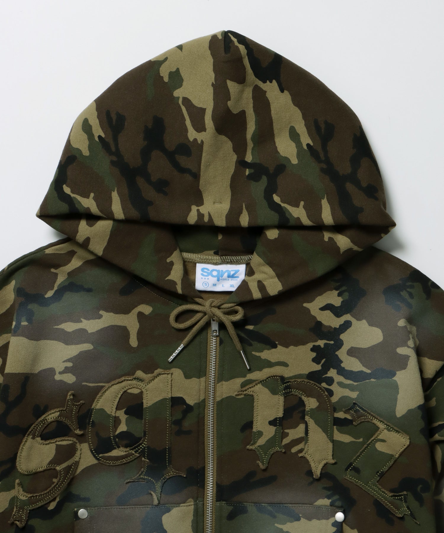 sqnz washed wappen zip p/k / フェード ジップパーカー スタッズ フルジップ オーバーサイズ ヴィンテージライク センターロゴ 裏起毛 柄80