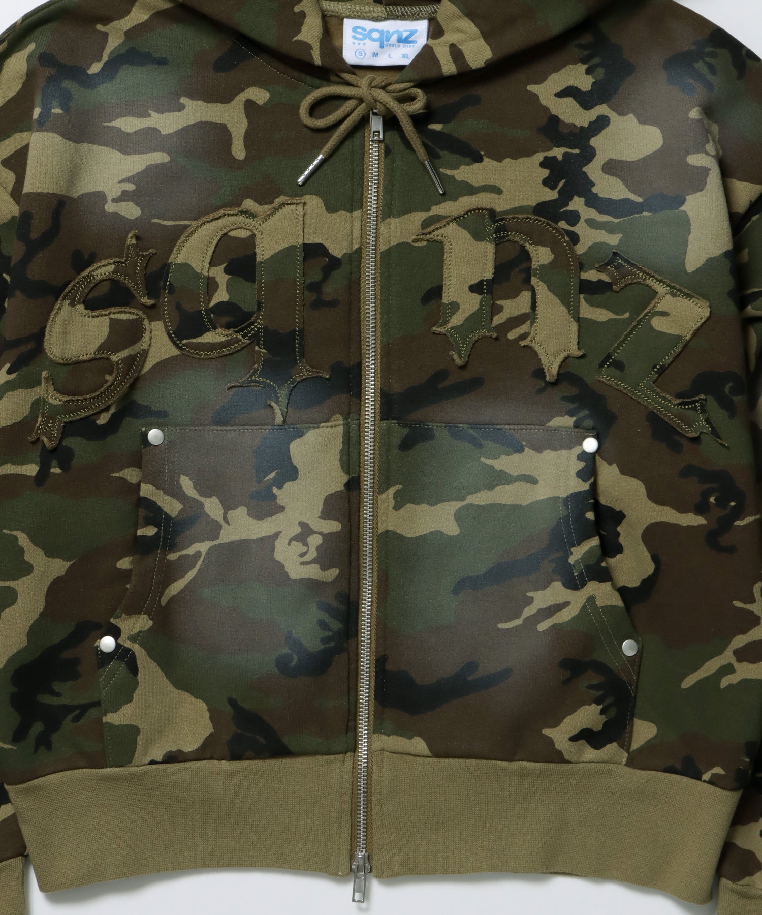 sqnz washed wappen zip p/k / フェード ジップパーカー スタッズ フルジップ オーバーサイズ ヴィンテージライク センターロゴ 裏起毛 柄80