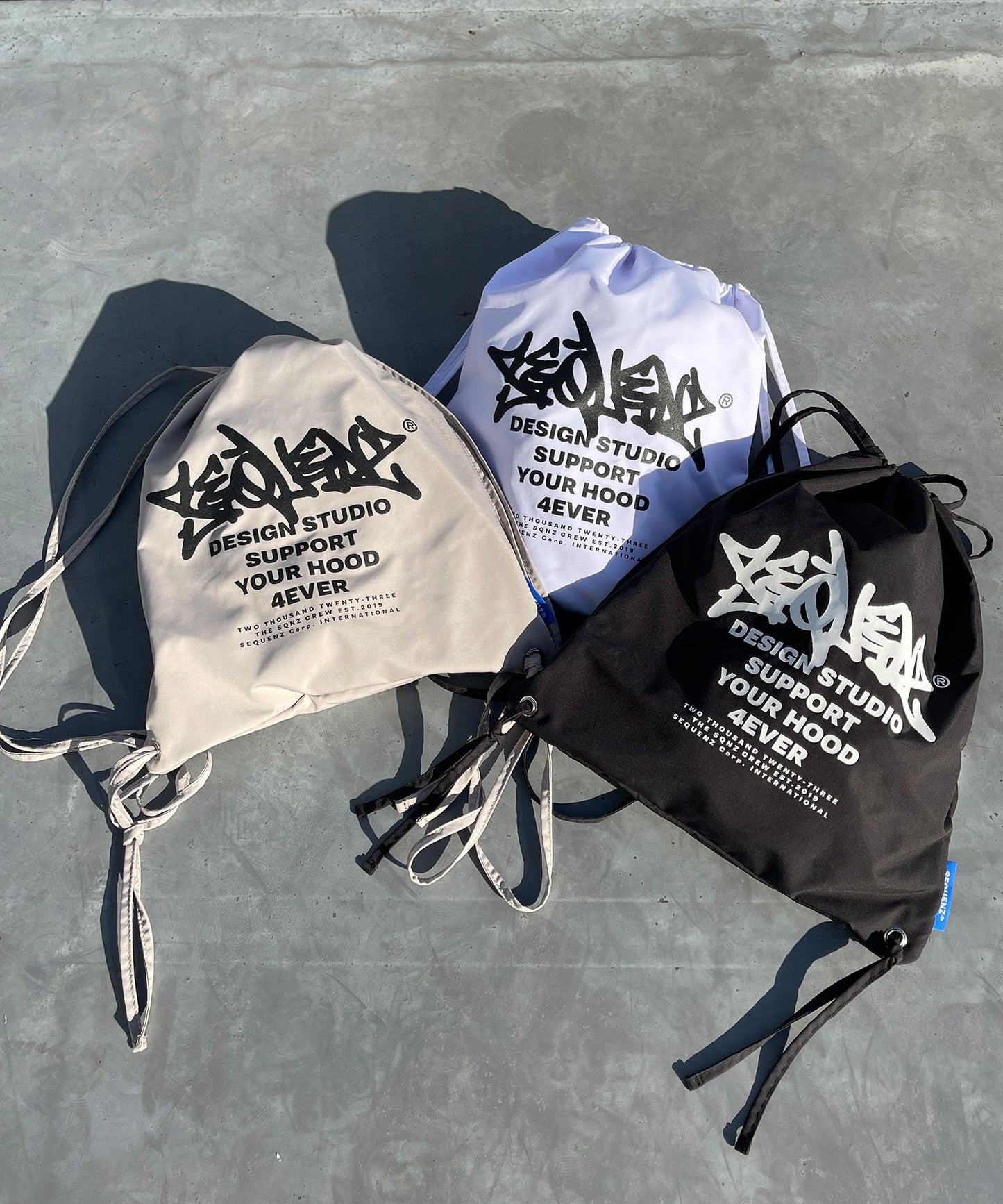 2 FACE STRING KNAPSACK / リバーシブル テック ナップサック ブランドロゴ サンドベージュ