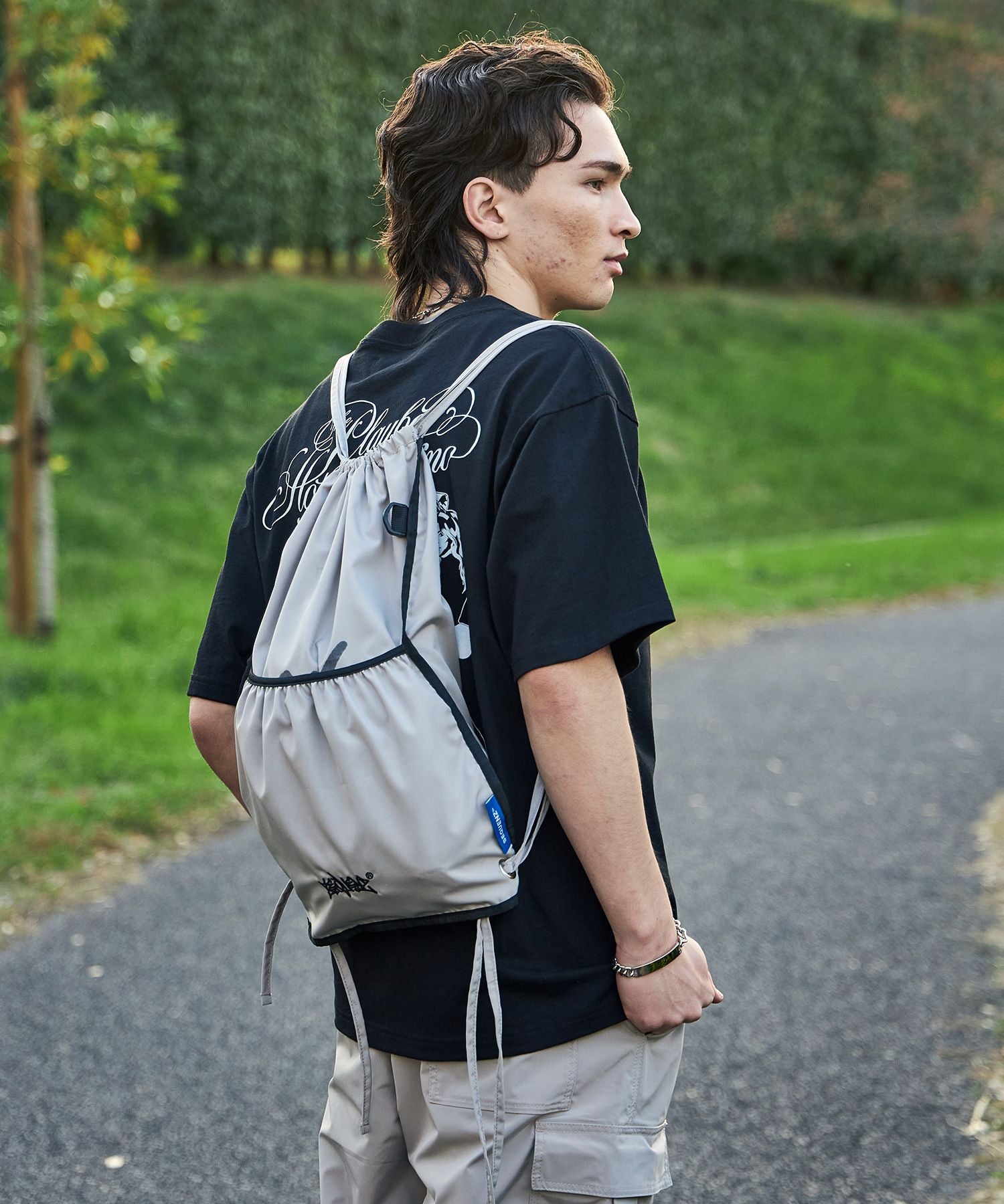 2 FACE STRING KNAPSACK / リバーシブル テック ナップサック ブランドロゴ サンドベージュ