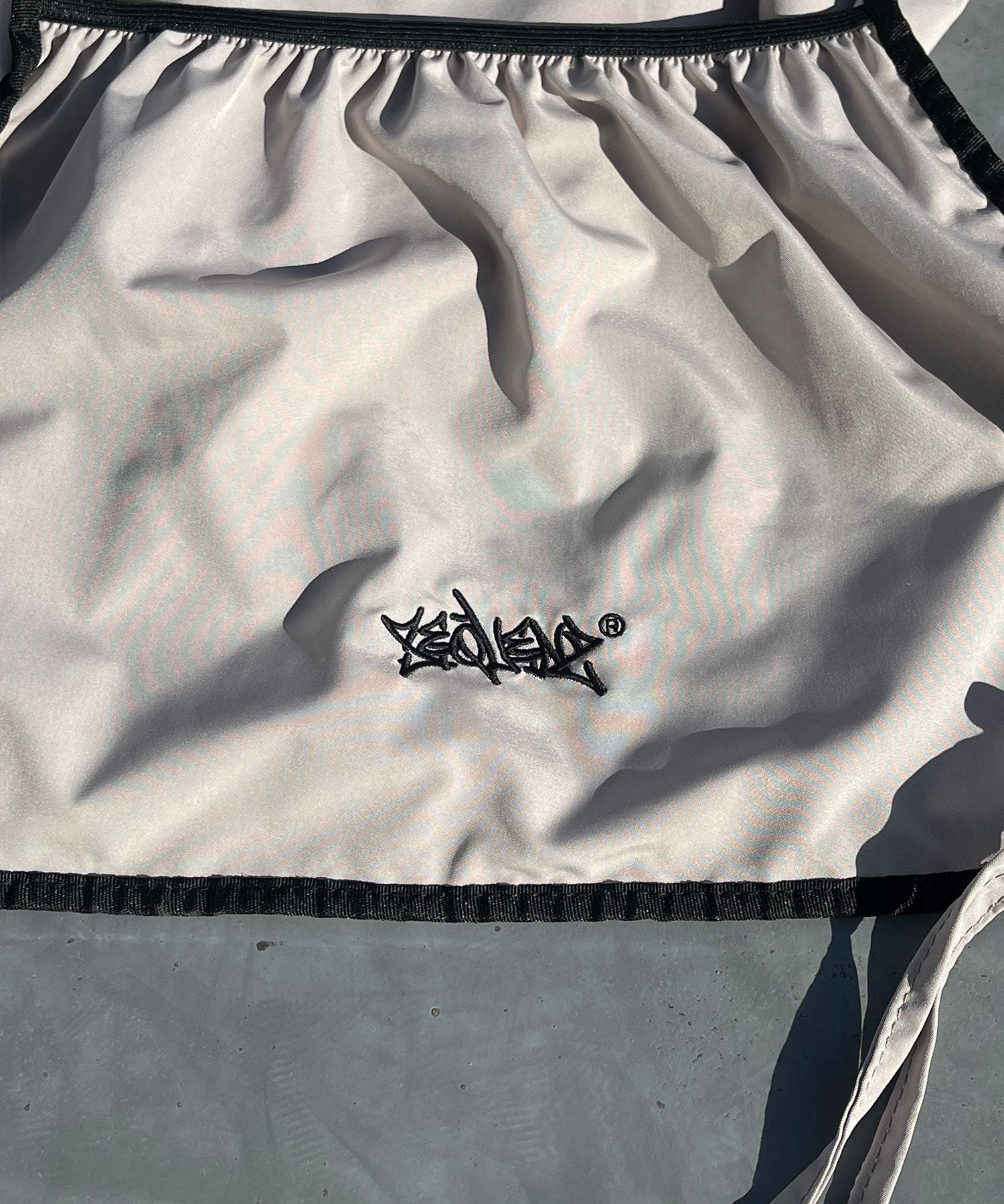 2 FACE STRING KNAPSACK / リバーシブル テック ナップサック ブランドロゴ サンドベージュ