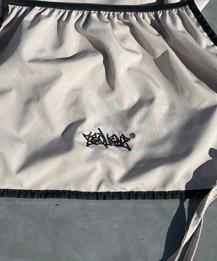 2 FACE STRING KNAPSACK / リバーシブル テック ナップサック ブランドロゴ サンドベージュ