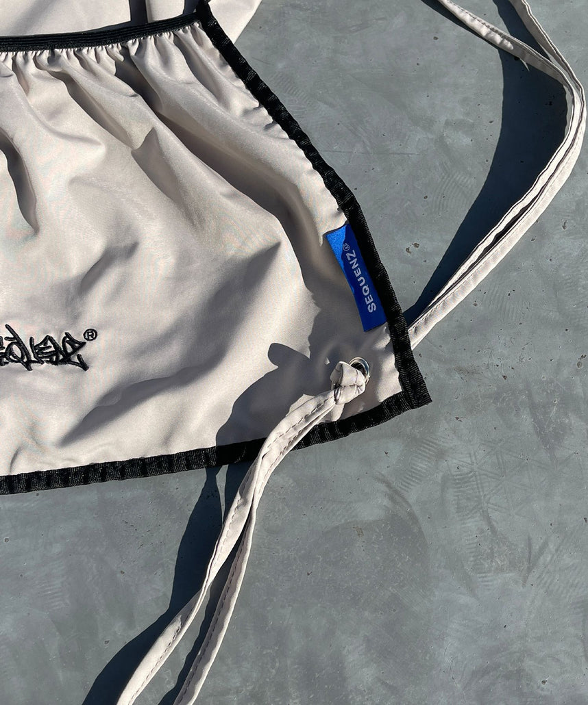 2 FACE STRING KNAPSACK / リバーシブル テック ナップサック ブランドロゴ サンドベージュ