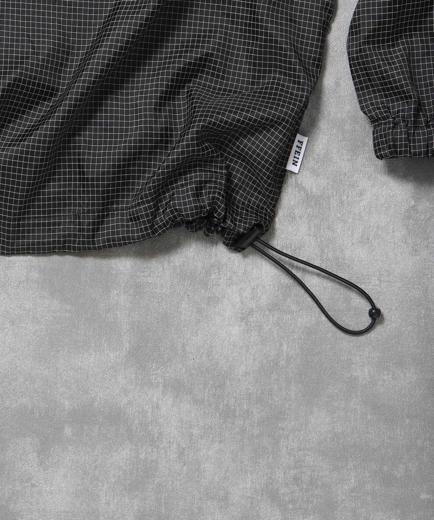 ナイロンチェックドローコードブルゾン / ポロシャツ ナイロン プリント ドローコード チェック ポケット ブラック